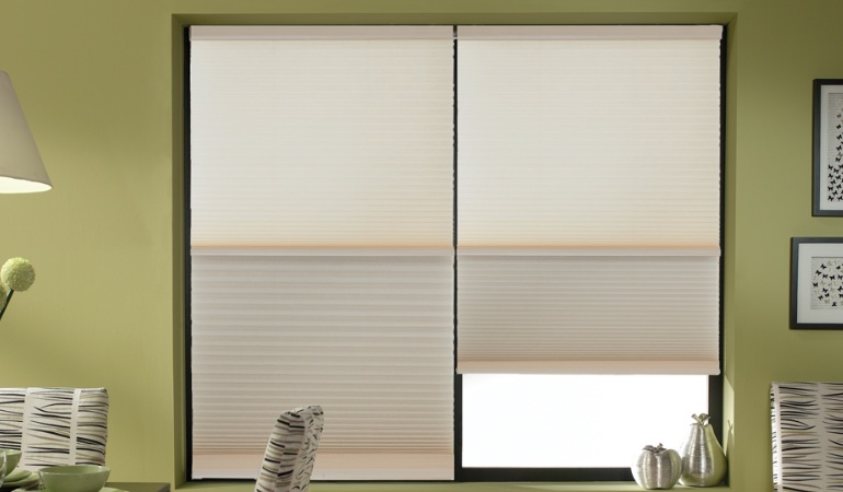 Cellular shades are produced in a multitude of colors and patterns. Cellular shades by in a Raleigh dining room.