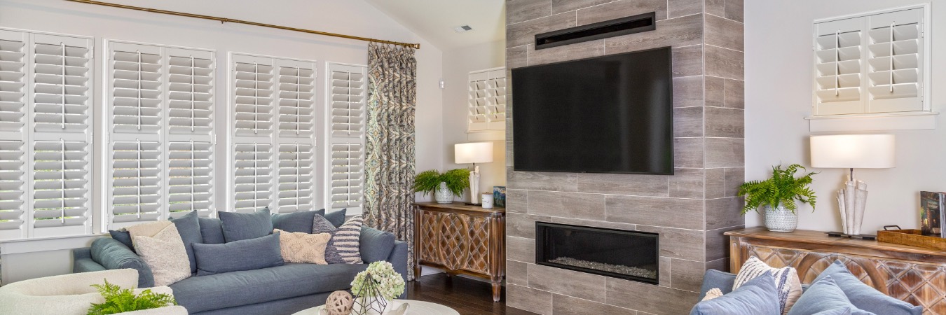 Plantation shutters in Chapel Hill family room with fireplace