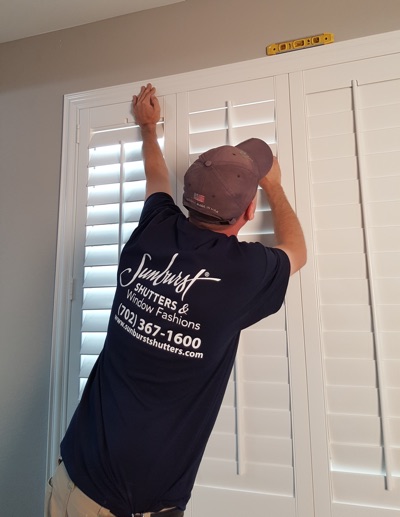 Shutter installation in Raleigh bedroom.