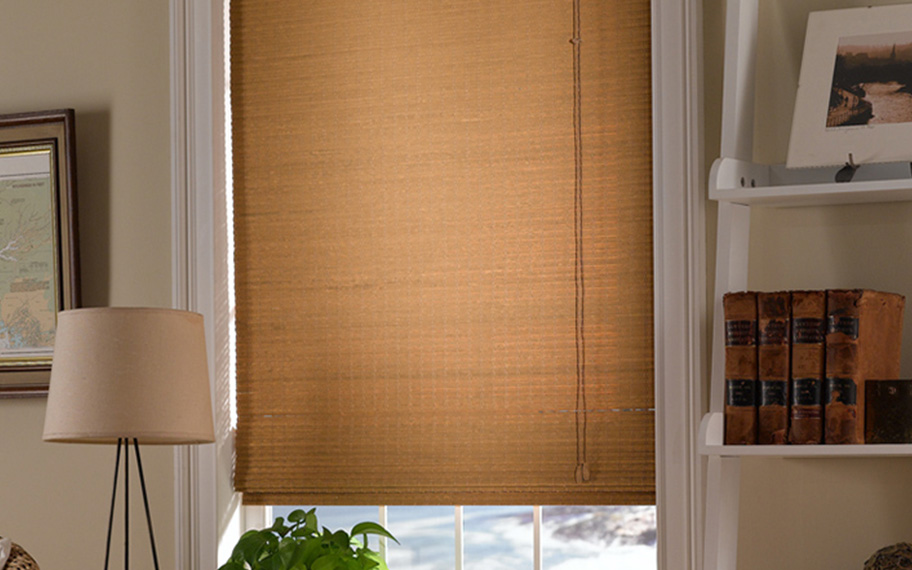 Add a touch of nature to your decor with woven fiber shades in Raleigh. Tan woven fiber shades in a living room