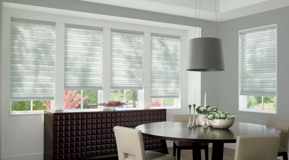 Custom cordless roller shades have a clean look and are appropriate for any room. Cordless motorized shades in a Raleigh dining room