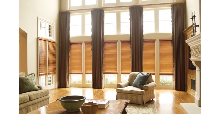 Raleigh great room with wood blinds and full-length draperies. Raleigh great room with wood blinds and full-length draperies.