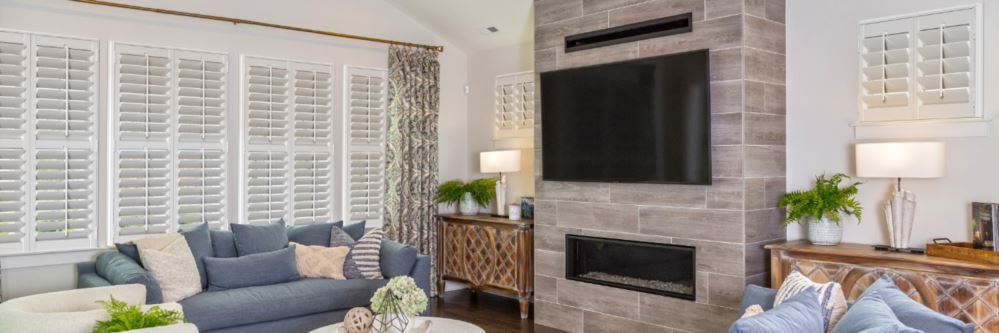 Plantation shutters in a Henderson family room with fireplace