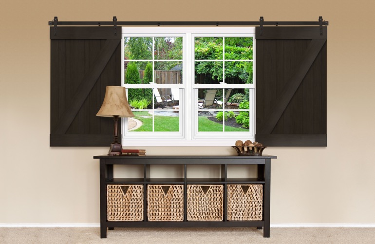 Sliding Barn Doors As A Window Treatment In Raleigh Window covered by sliding barn doors