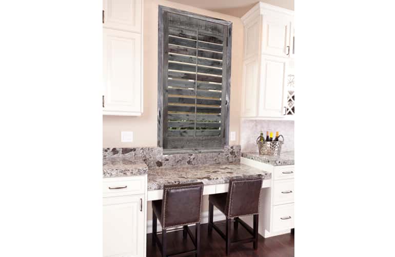 Kitchen window with reclaimed wood shutters in Raleigh