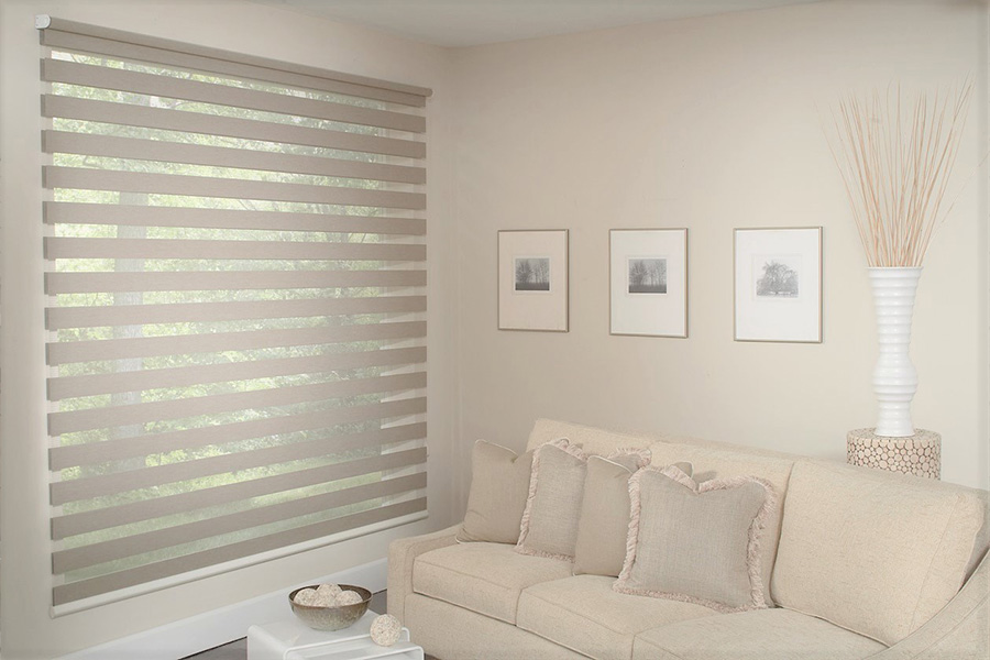 Innovative transitional shades give you more ways to control light than the average shade. eige transitional shades on a living room window