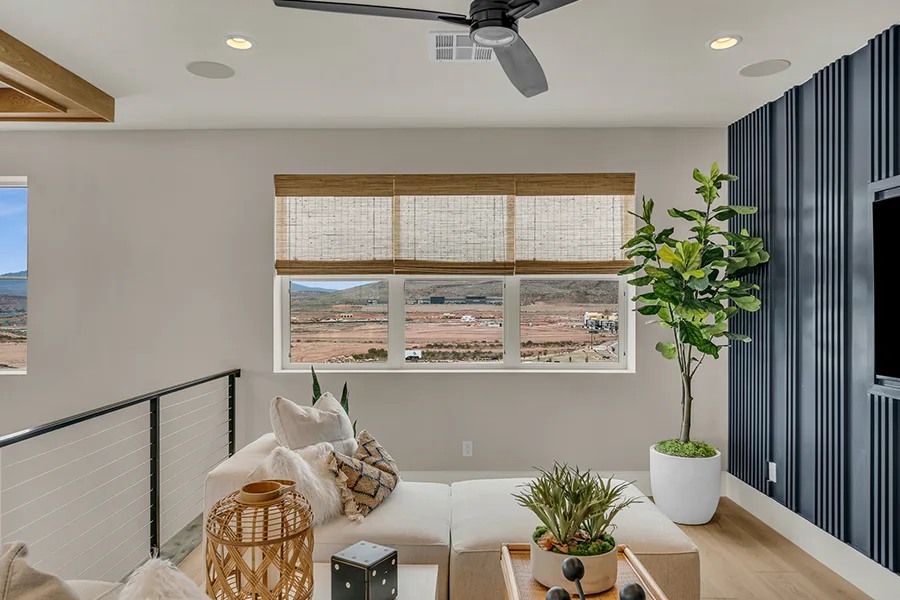 Raleigh homeowners who want eco-friendly home fixtures should consider natural woven shades. Natural brown woven shades on a window in a stylish sitting area