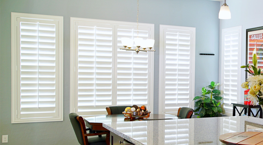 White plantation shutters in a kitchen.