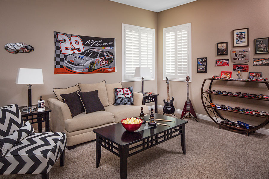 Keep valuables in your basement? Keep the sun off of them and prying eyes away with basement window treatments. Polywood interior shutters on basement windows next to collectible cars